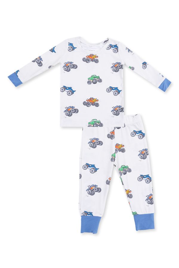 A two-piece children's pajama set featuring a long-sleeve top and matching pants. The pajamas are white with an all-over print of colorful monster trucks, finished with solid blue cuffs on the sleeves, pants ankles, and waistband.