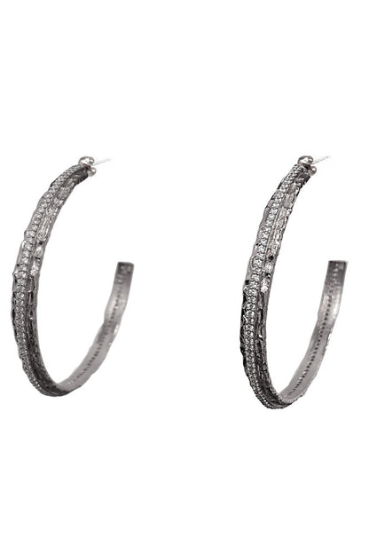 A pair of silver-tone crystal thin hoop earrings embellished with multiple rows of small clear stones, shown against a plain white background.