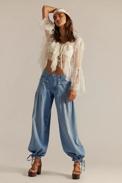 Light blue wide-leg jeans with button front and side pockets