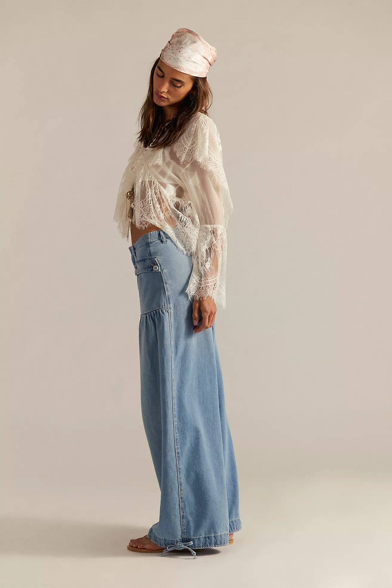 Light blue wide-leg jeans with button fly and frayed hem