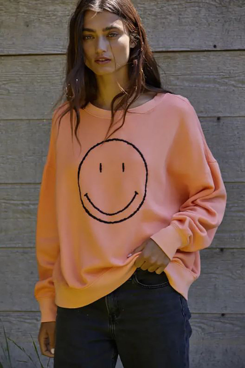 Make me smile pullover in neon salmon front view