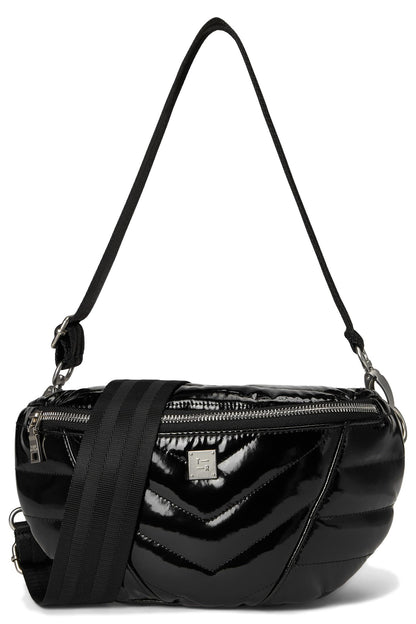 A black patent leather crossbody bag with a glossy chevron quilted front panel, a black webbing strap, and a small silver-tone logo plaque on the front, shown against a plain white background.