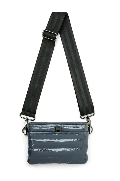 BUM BAG CROSSBODY IN CARBON PATENT FRONT VIEW
