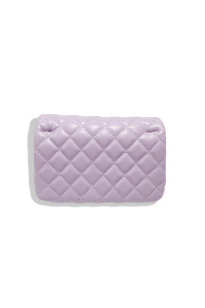 pearl closure quilted purse in purple back view