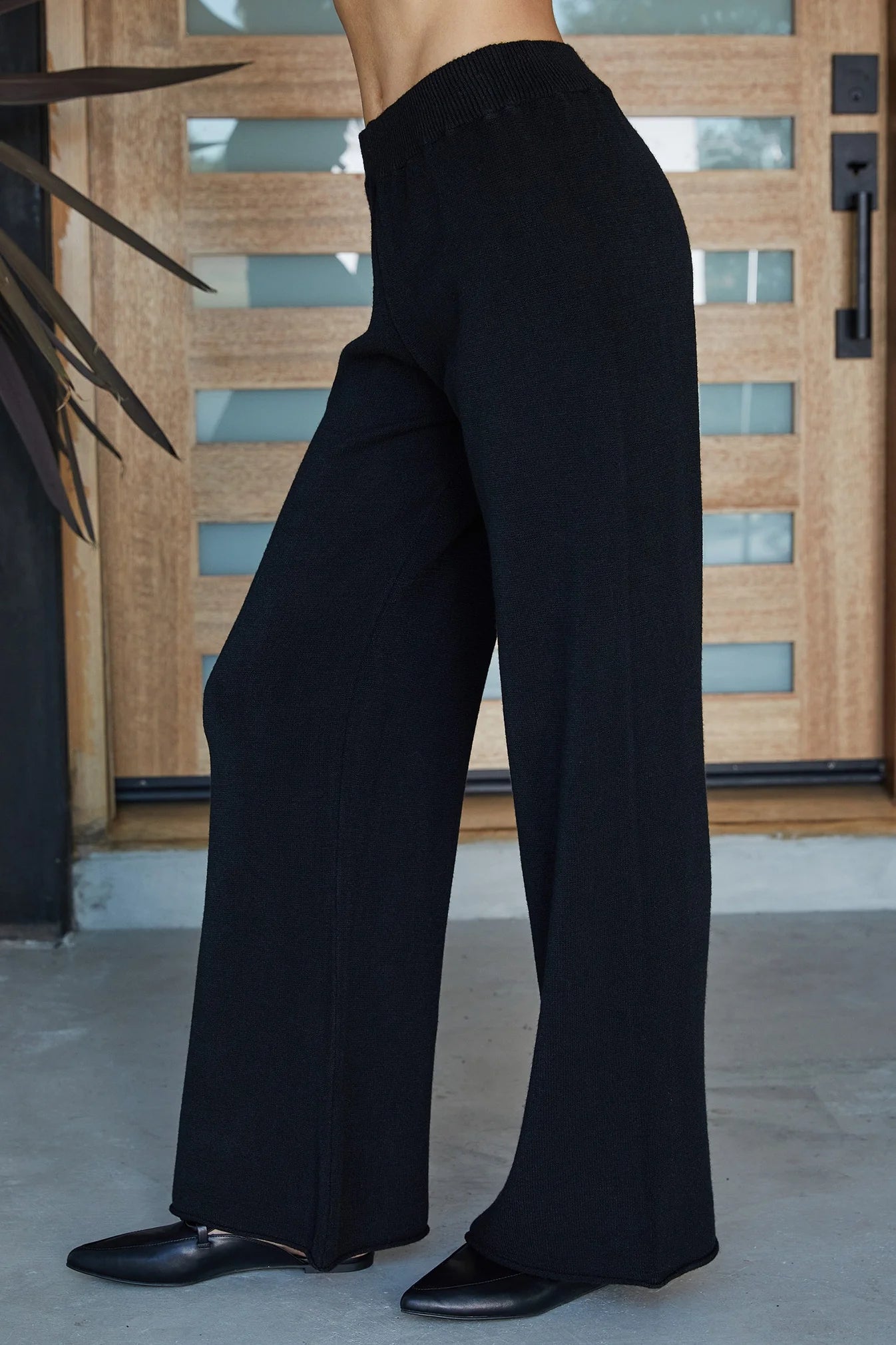 ITALIAN VISCOSE KNIT FLARED PANT IN BLACK FRONT VIEW