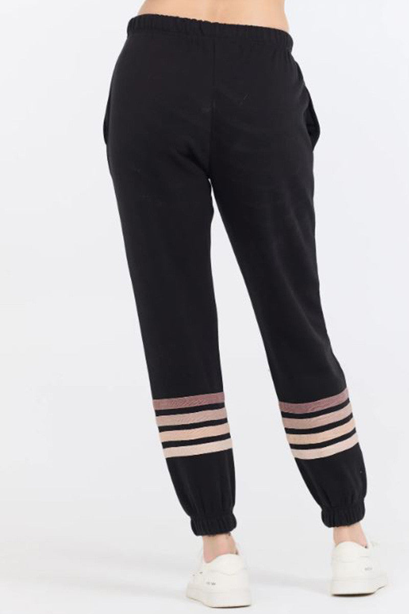 Stripe burnout fleece jogger in black/neutral back view 