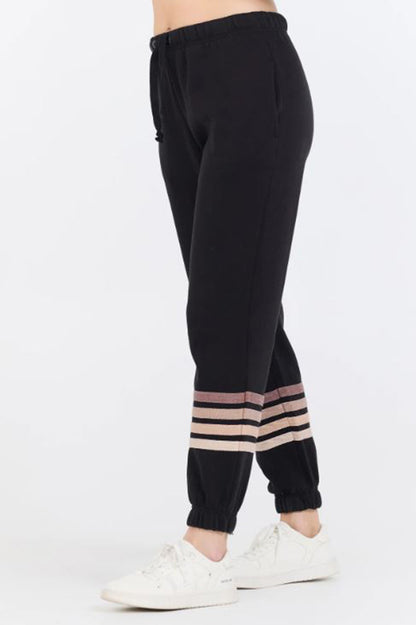 Stripe burnout fleece jogger in black/neutral side view 