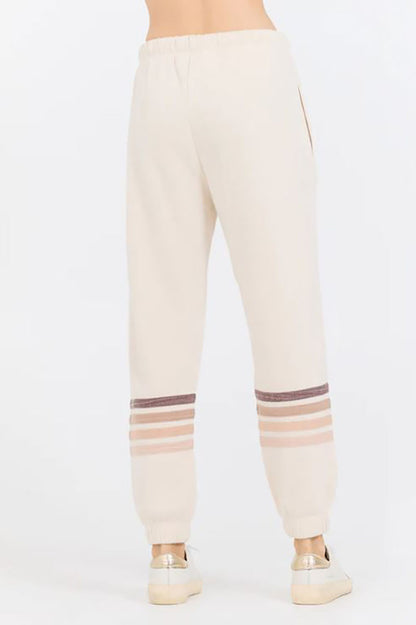 Stripe burnout fleece jogger in french vanilla/neutral back view 