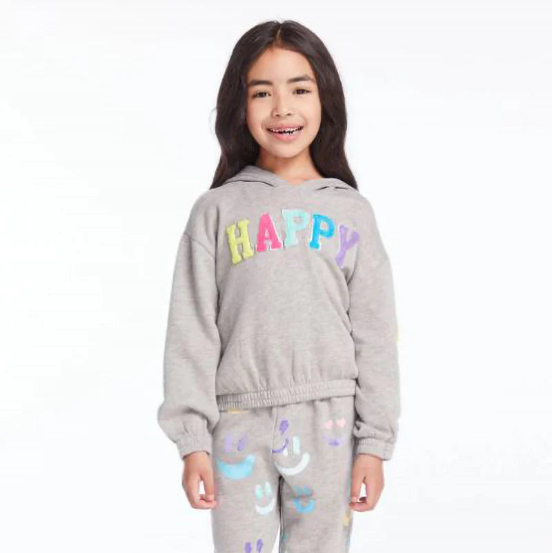 Child wearing a gray hoodie with 'HAPPY' in colorful letters and matching pants with cloud designs on a white background.