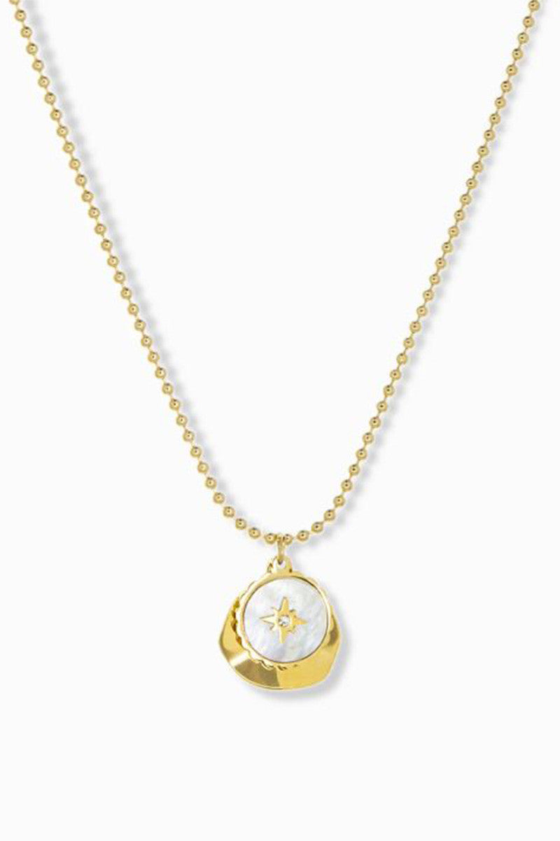 delicate chain with pearl coin compass and hammered gold charm
