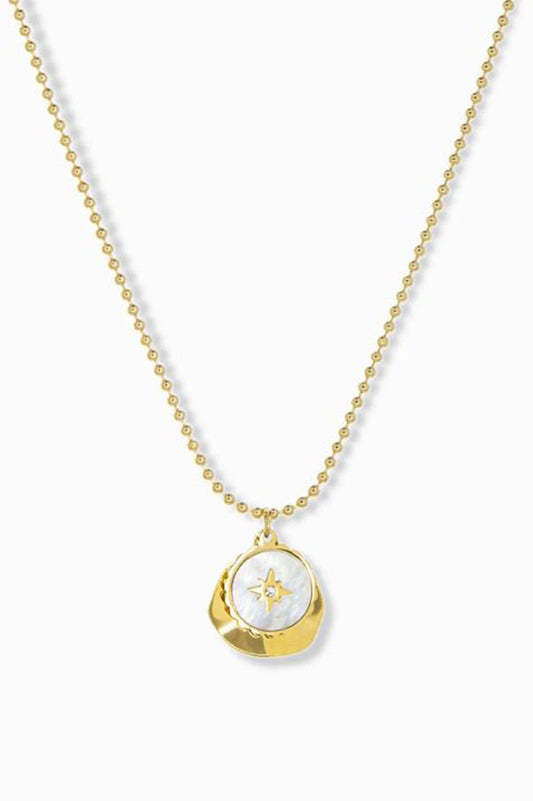 delicate chain with pearl coin compass and hammered gold charm

