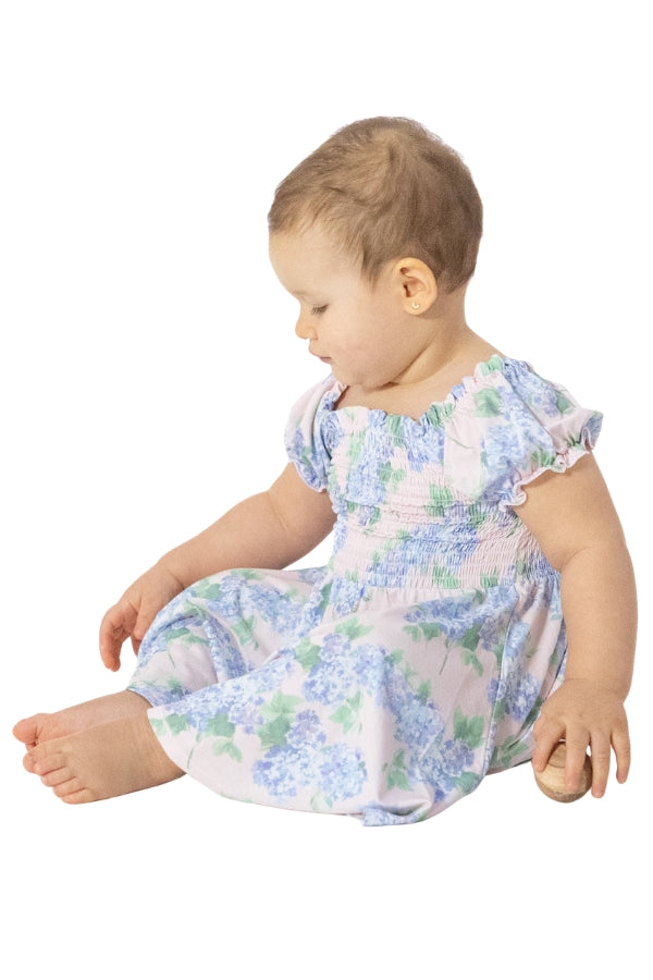 Smocked twirly dress with bloomers, pastel floral print, flutter sleeves and gathered bodice