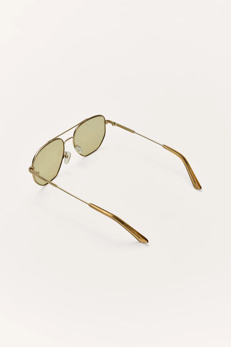 Close side view aviator sunglasses, khaki polarized lenses and slim gold temples