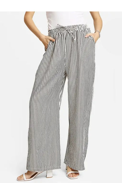 Striped wide-leg pants with smocked drawstring waistband, black-and-white vertical stripes
