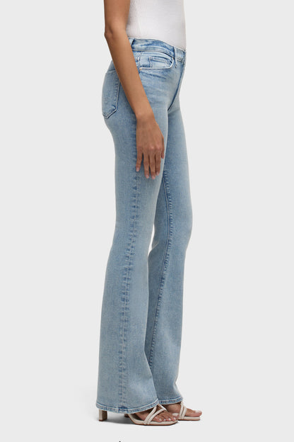 Side view: High-rise bootcut jeans in light blue wash, seam detailing and belt loops