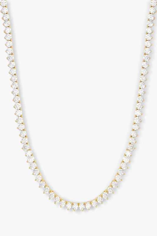 Gold-tone tennis necklace with small white rhinestone stations, 16-inch length