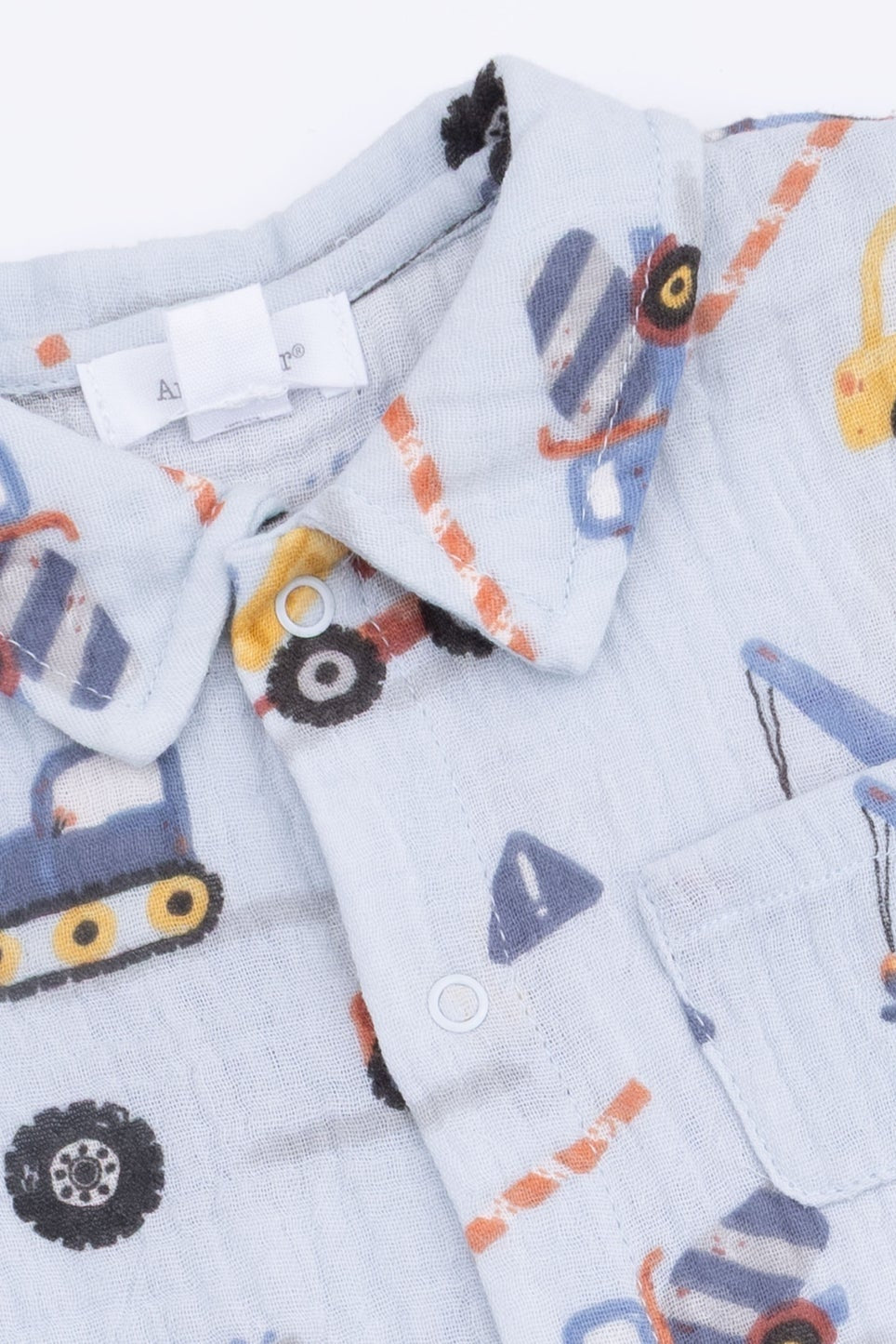 Light blue button-front polo romper collar detail with vehicle print