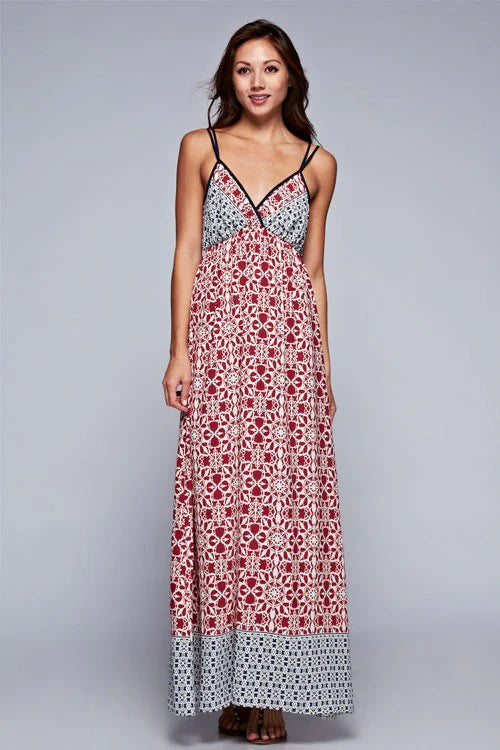 Maxi dress with dusty pink/red floral paneling and blue patterned hem, thin straps