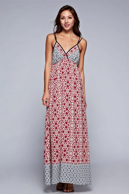 Maxi dress with dusty pink/red floral paneling and blue patterned hem, thin straps