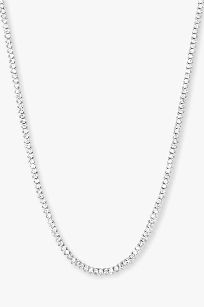 Tennis necklace with white stones on silver-tone chain, arched center detail