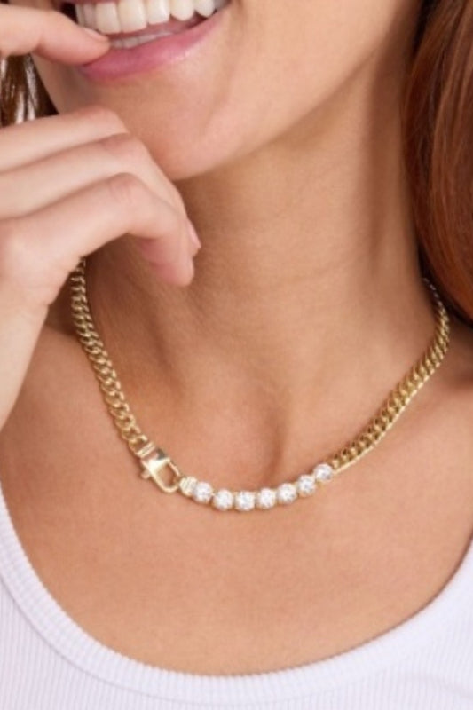 Gold chain necklace with oval white stones and diamond-style accents