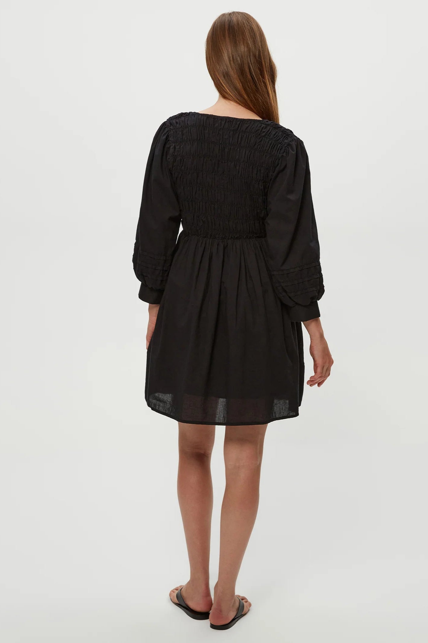 Zuri smocked mini dress in black back view