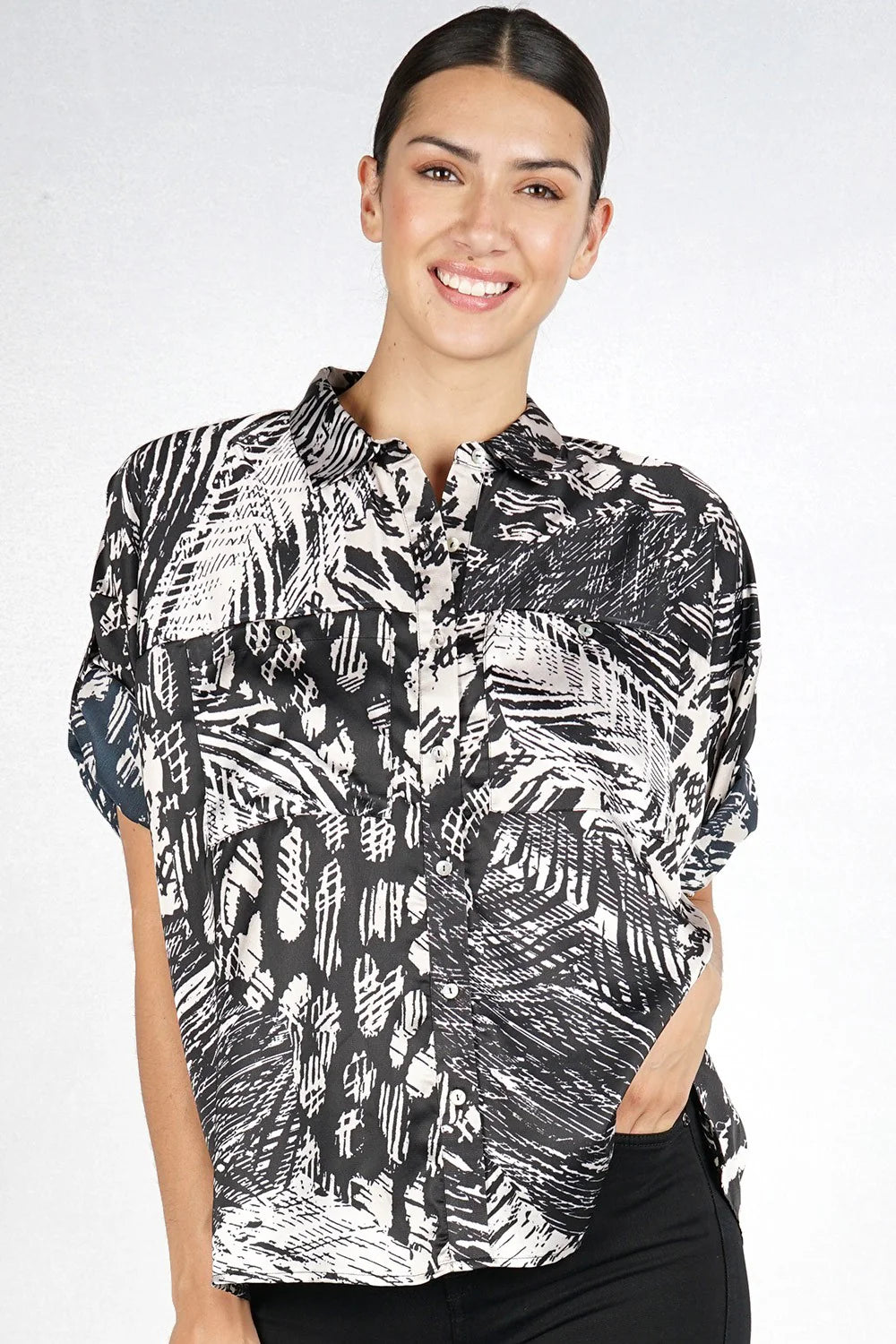 Button down top with cuffed sleeve in black natural front view
