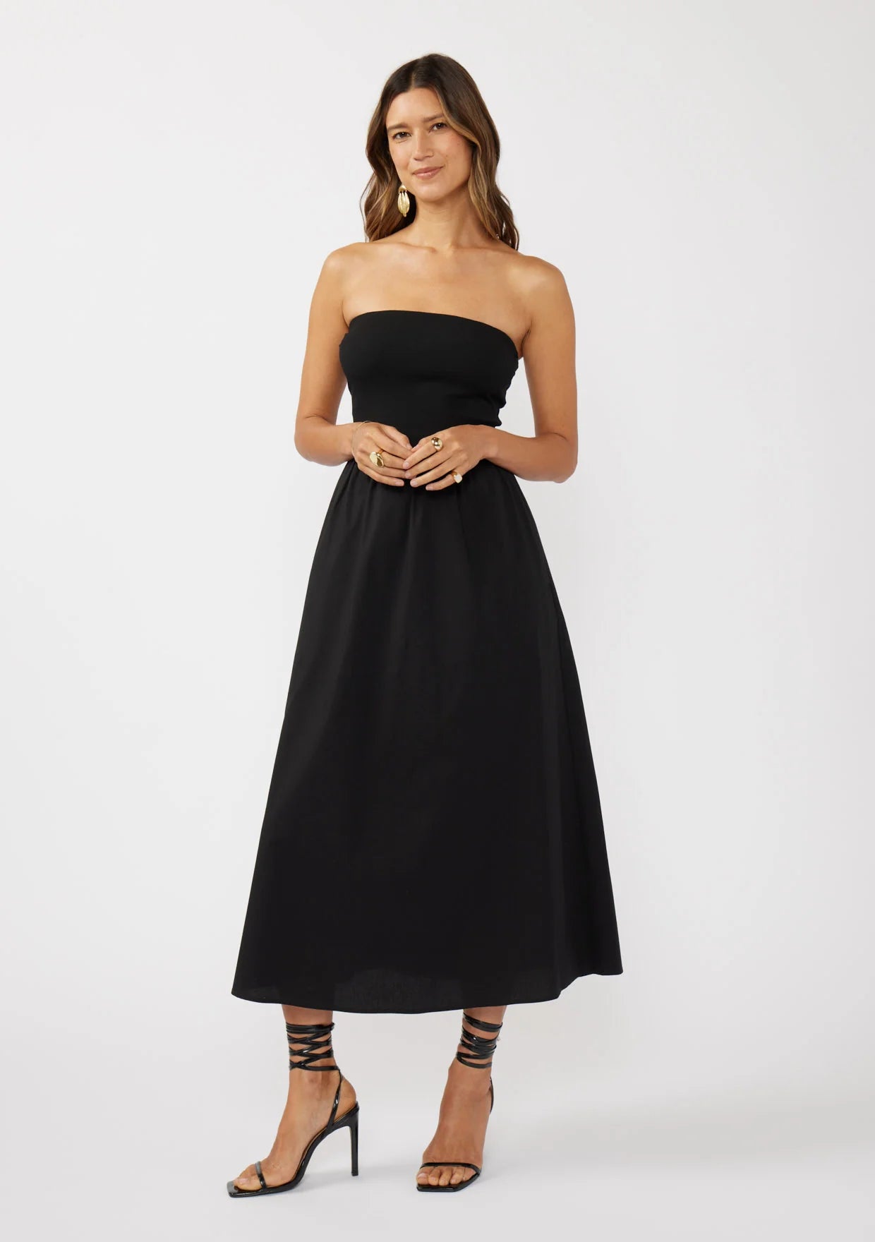 Tube dress with pockets in black front view