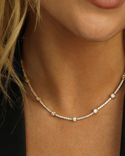 She's an icon station necklace 16" in gold with white diamonds style view