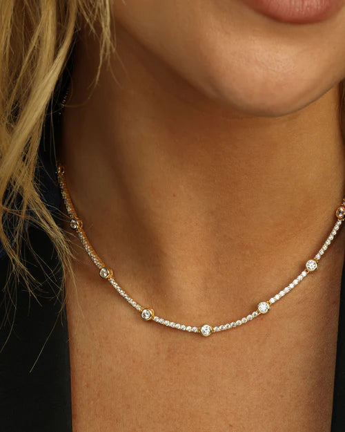 She's an icon station necklace 16" in gold with white diamonds style view