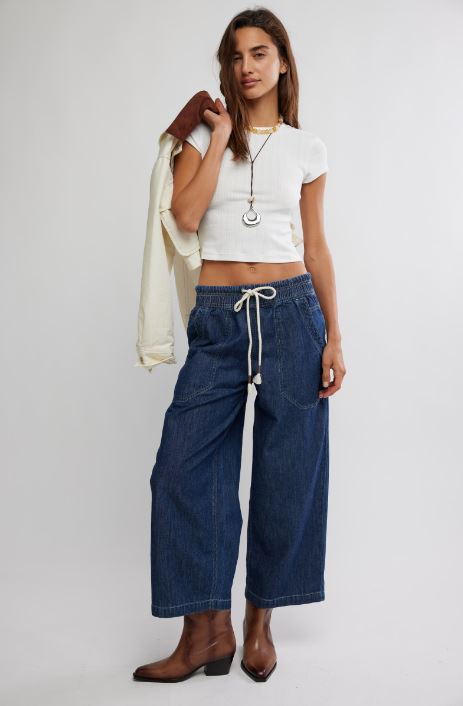 Dark blue denim pull-on jeans with drawstring waist and large patch pockets