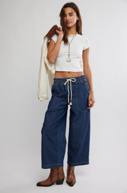 Dark blue denim pull-on jeans with drawstring waist and large patch pockets