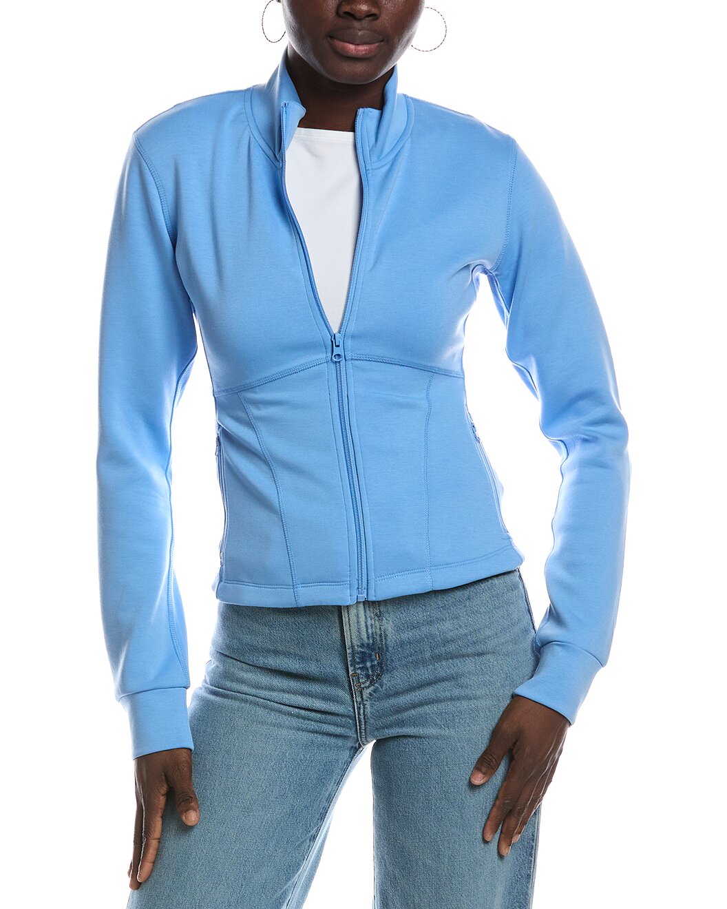 A woman wearing a salty blue zip-up jacket with a stand collar