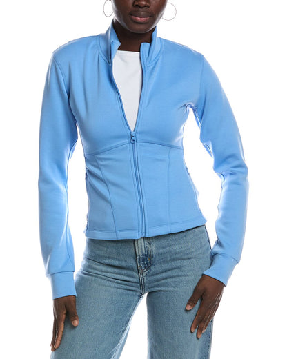 A woman wearing a salty blue zip-up jacket with a stand collar