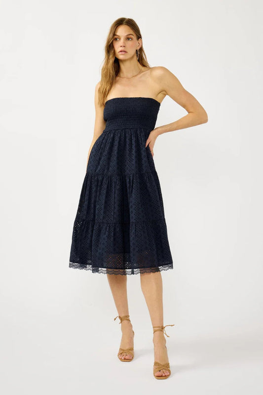 SMOCKED BUST TIERED EYELET DRESS IN NAVY FRONT VIEW