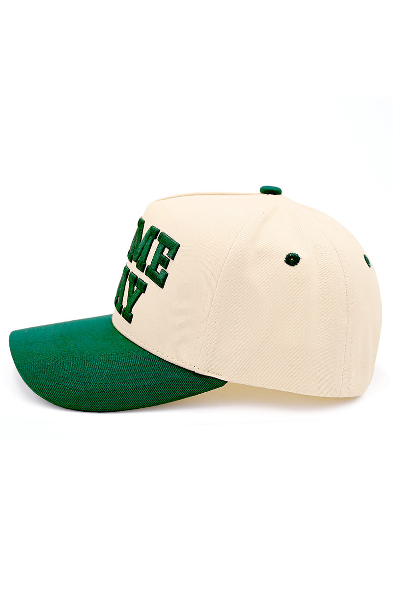 Embroidered game day trucker hat in dark green and beige side view