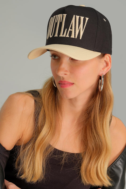 Outlaw trucker hat in black and cream style view