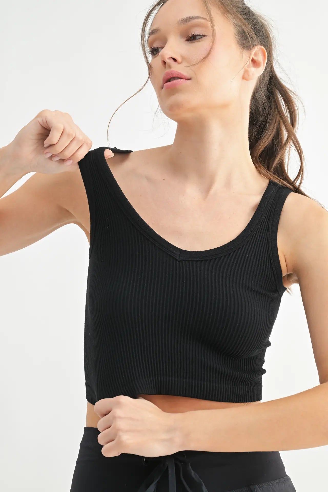 Ribbed seamless cropped tank in black front view