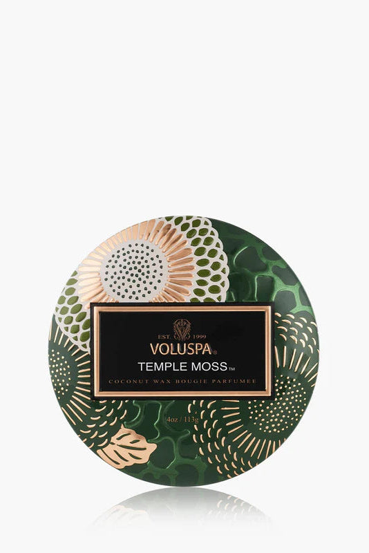 Mini tin candle in green patterned tin with Temple Moss label and visible lid
