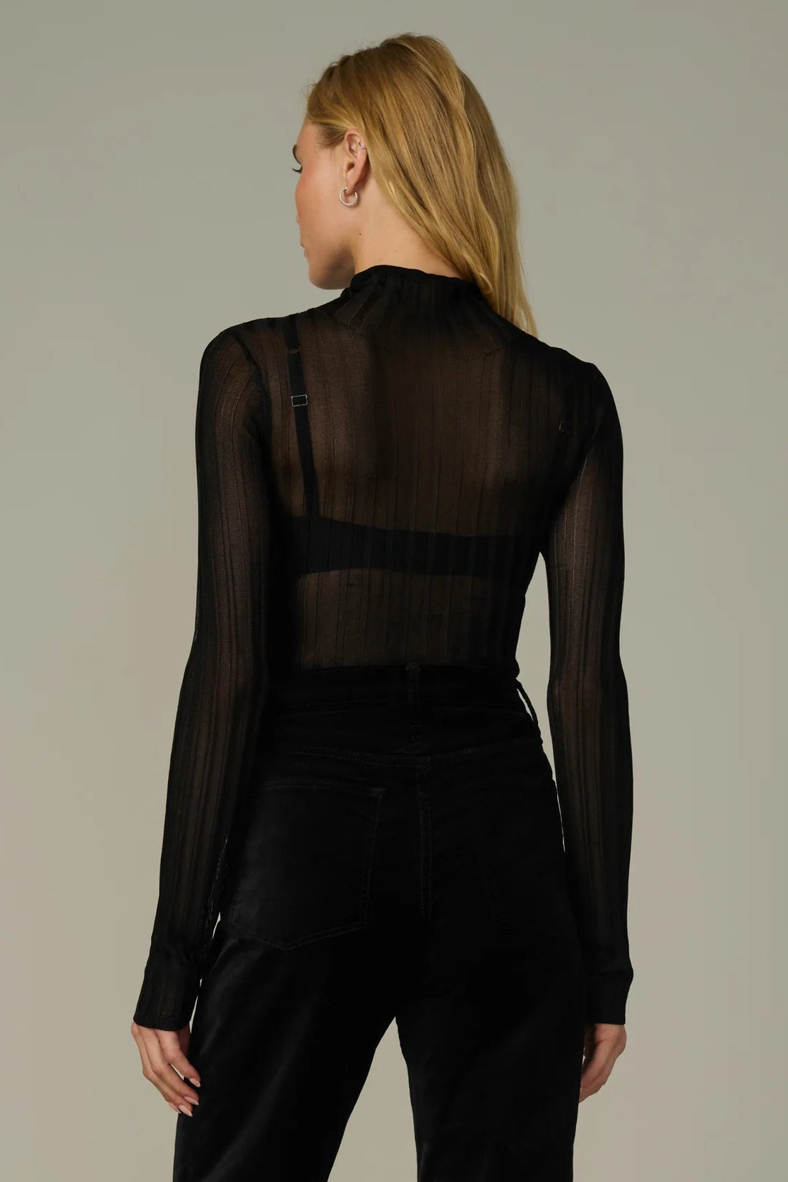 THE LANA RIBBED TURTLENECK IN BLACK BACK VIEW