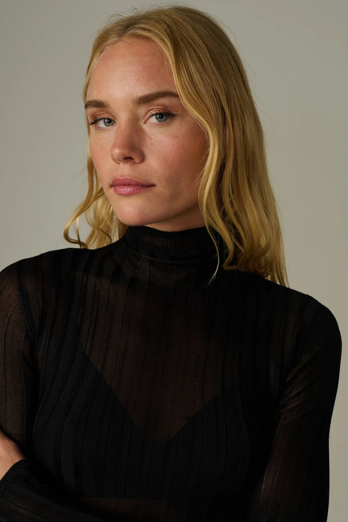 THE LANA RIBBED TURTLENECK IN BLACK FRONT CLOSE UP VIEW