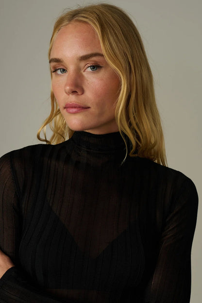 THE LANA RIBBED TURTLENECK IN BLACK FRONT CLOSE UP VIEW