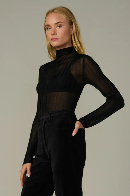 THE LANA RIBBED TURTLENECK IN BLACK SIDE VIEW