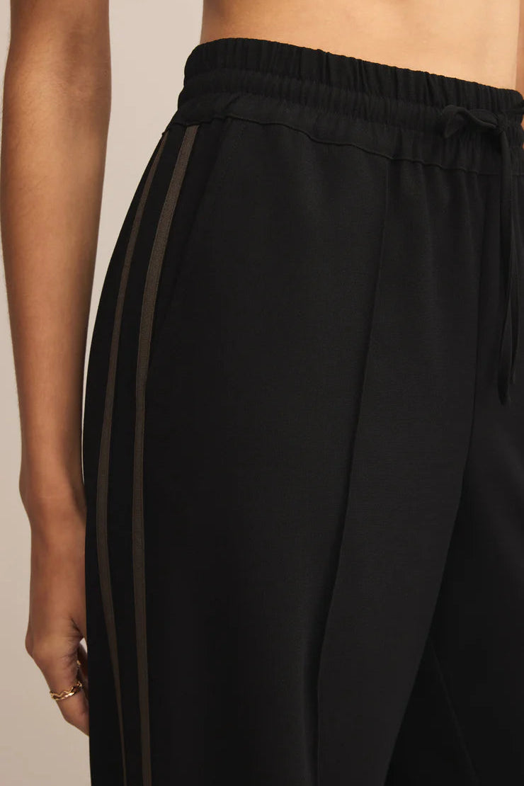 SAUNDER TRACK PANT IN BLACK CLOSEUP VIEW