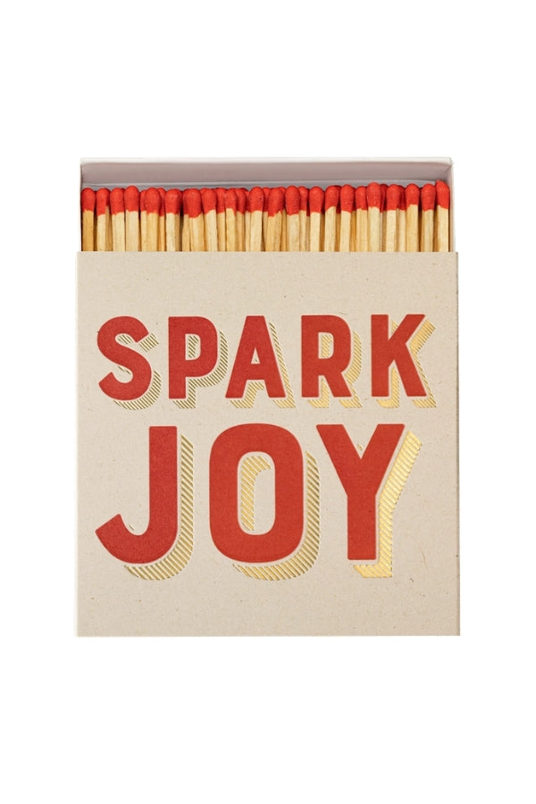 Spark Joy matchbox with red heads and light wood sticks