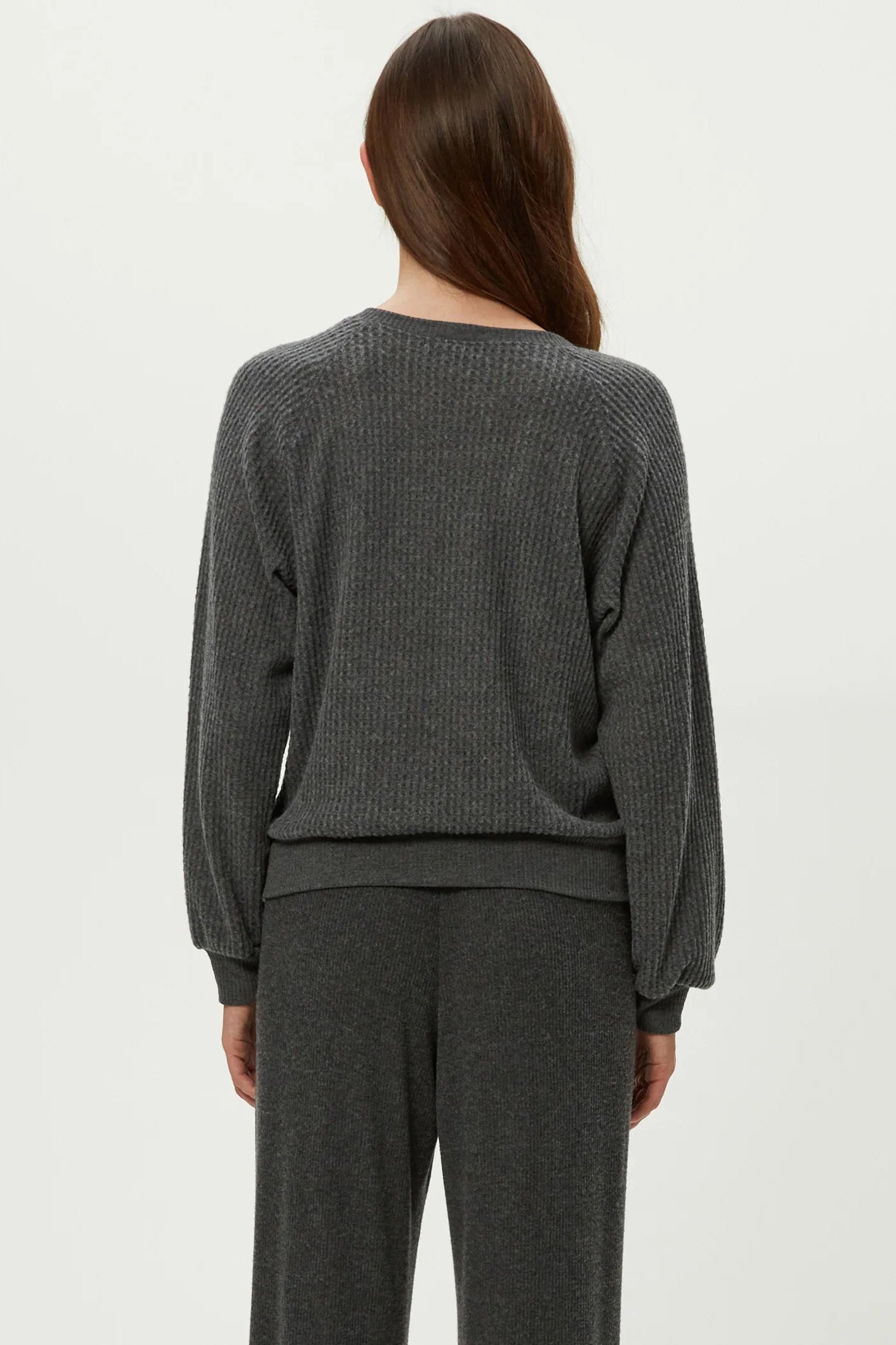 EIRA HENLEY RAGLAN LONG SLEEVE IN CHARCOAL BACK VIEW