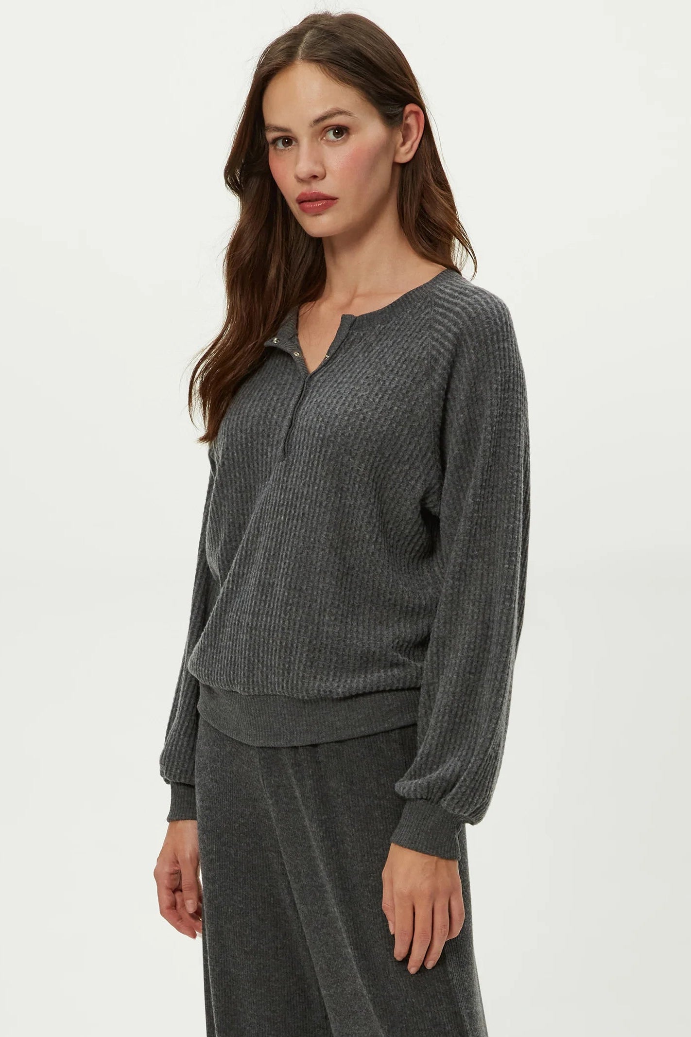 EIRA HENLEY RAGLAN LONG SLEEVE IN CHARCOAL SIDE VIEW