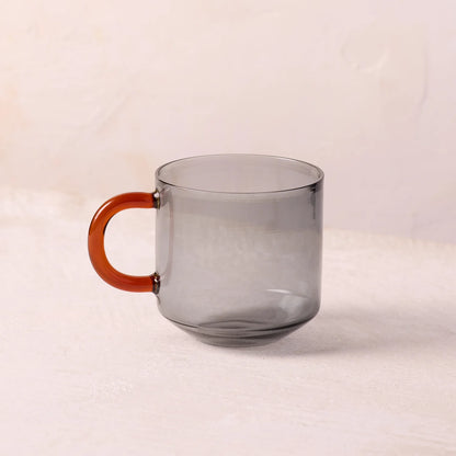 NIKO glass mug with gray body and orange handle