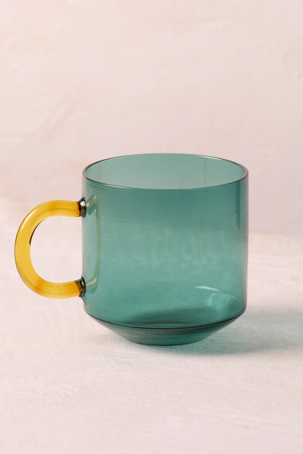 NIKO glass mug with teal body and yellow handle
