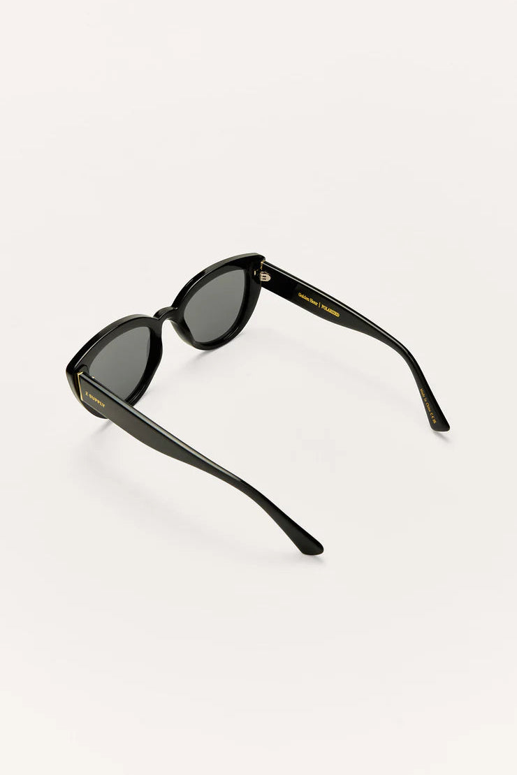 Black cat-eye sunglasses, angled view with dark lenses and temples